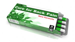 Cure for Back Pain, Pills Blister getting out from Green Box over White Background.